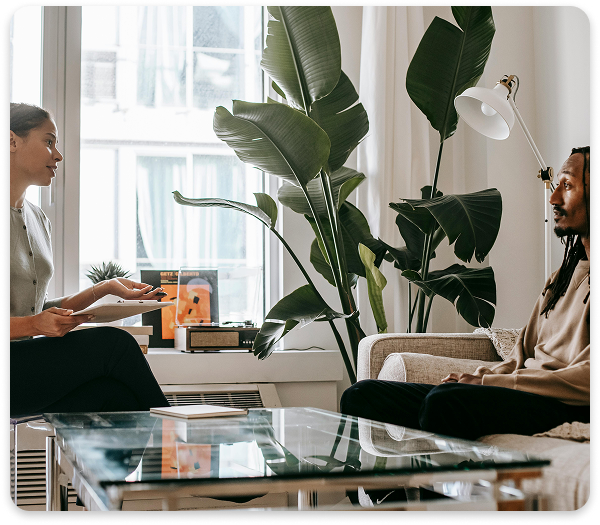 Personalized CBT Session – Bilingual, Inclusive Mental Health Care at Regions Praxis Care Therapist and client in a modern office setting discussing goals during a CBT session.